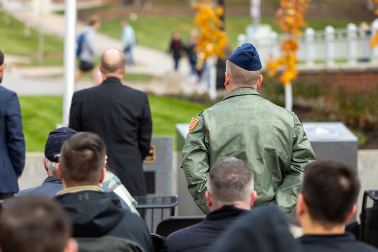 University officials and members of the armed forces celebrate the completion of the IMU Veterans Plaza.