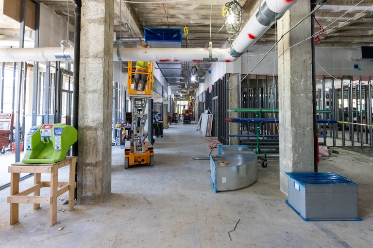 First Floor Wellness Center looking west pictured in May 2026 with construction tools and equipment in the space.