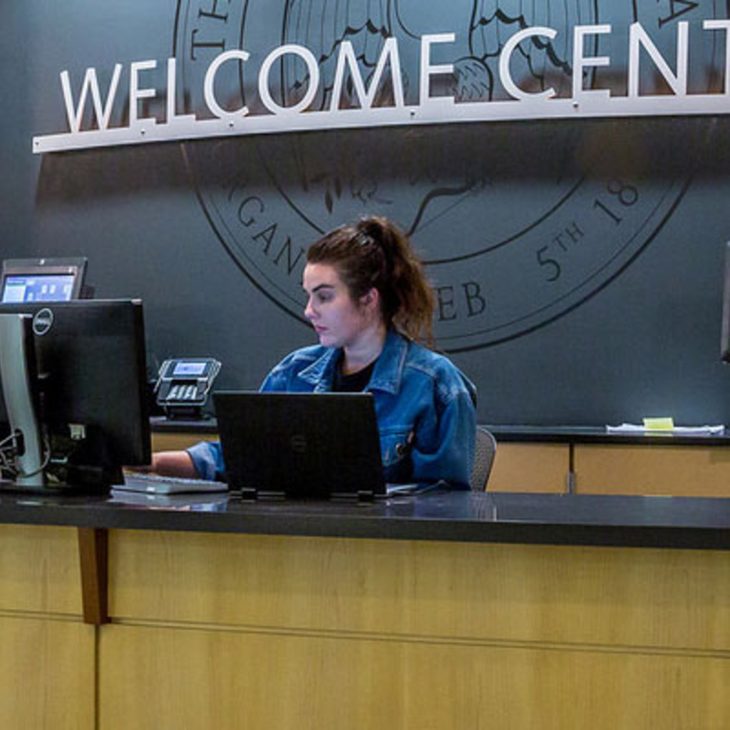 students working at the IMU welcome center