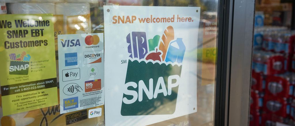 Photo of a sign that reads "SNAP welcomed here"