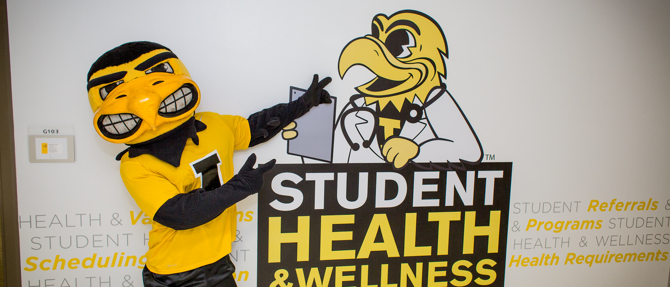 herky standing in front of student health entrance