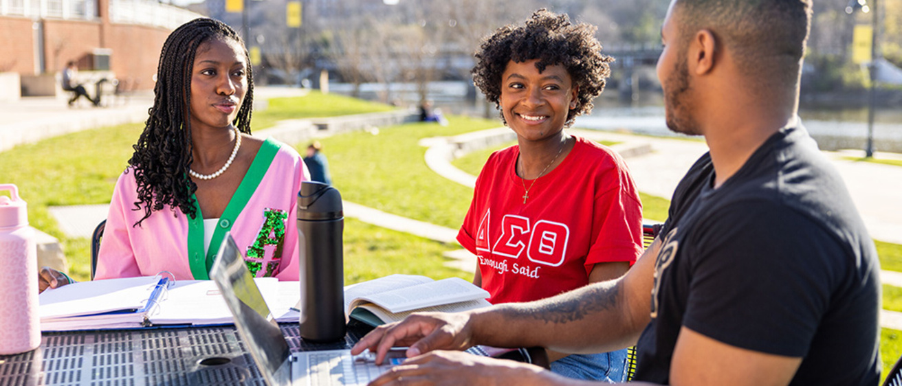 image of students meeting outdoors