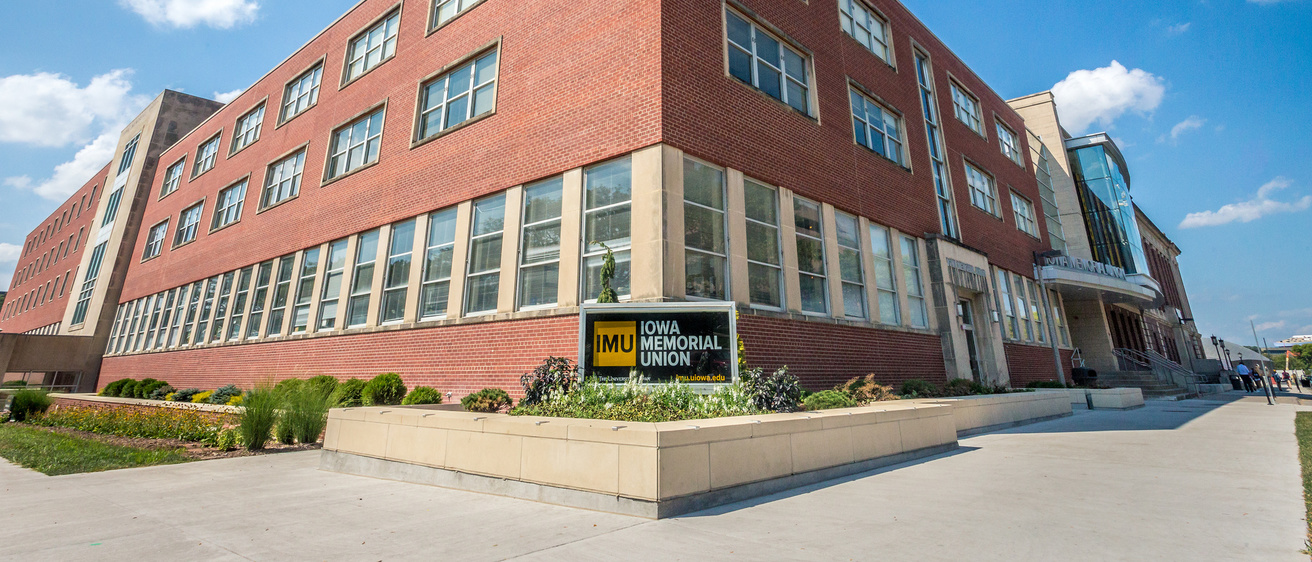 exterior shot of the IMU building in front of a clear sky