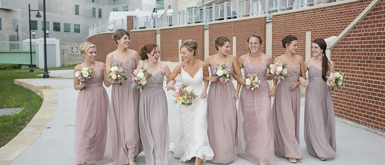 a group of bridesmaid and a bride posing in the IMU terrace