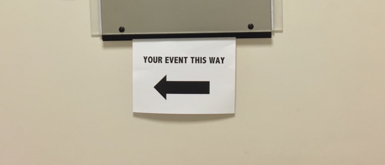 Directional signage in the IMU with a special sign that says "Your event this way"