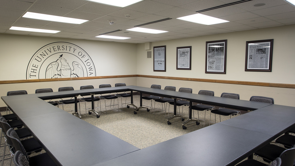 Eight tables in a square with twenty-four seats.