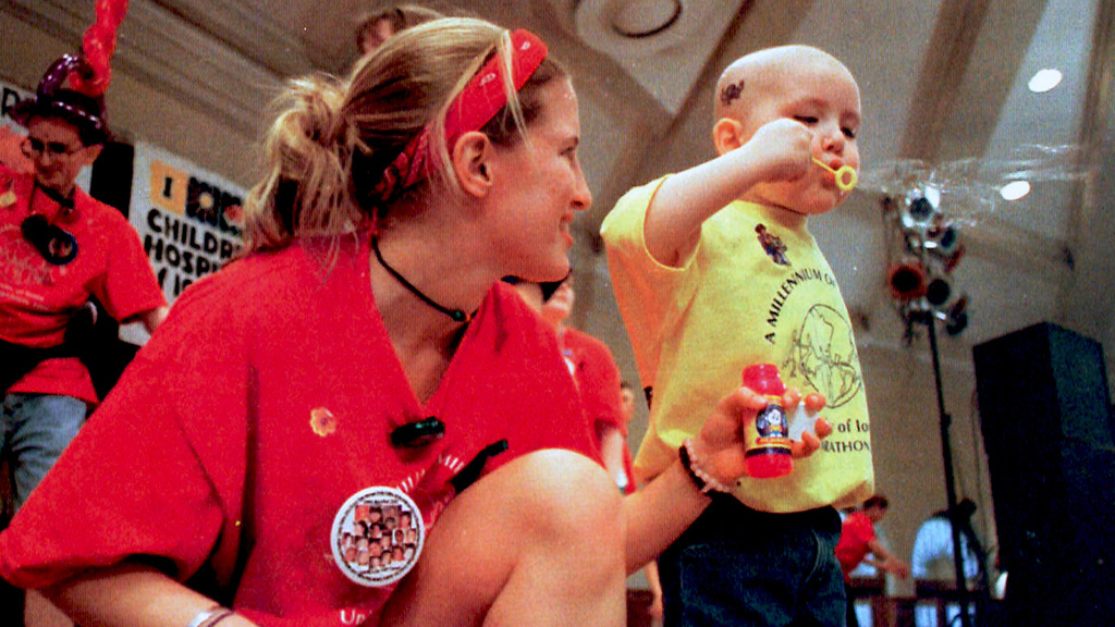 2000 dance marathon dancer with child