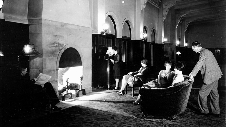 students near fireplace